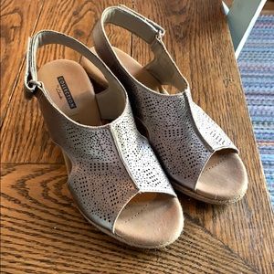 Never worn outside size 5 Clark’s gold wedges